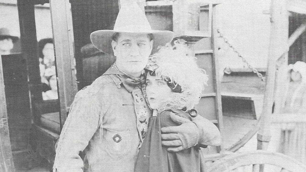 Spurs and Saddles backdrop