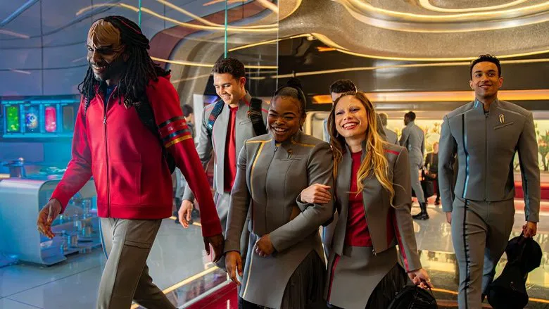 Cadets looking out a window at Starfleet Academy