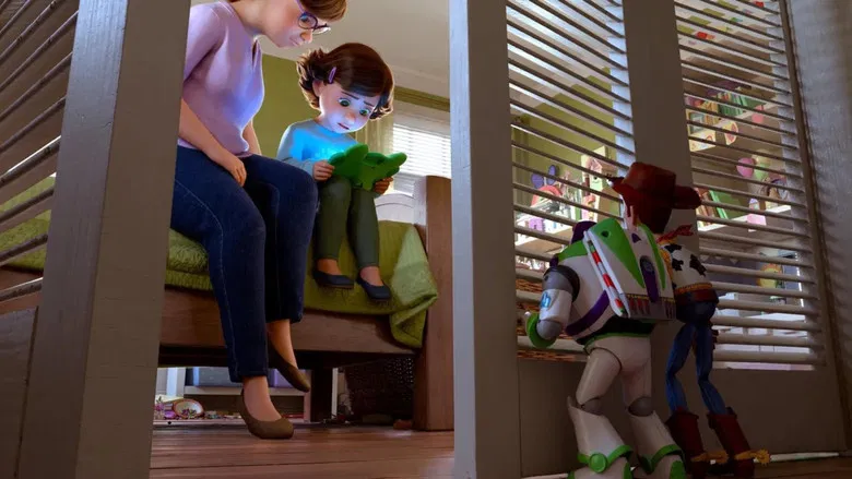 The toys watch Bonnie from the shadows while she stares at a glowing tablet